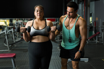 Fototapeta na wymiar Woman with obesity exercising to lose weight