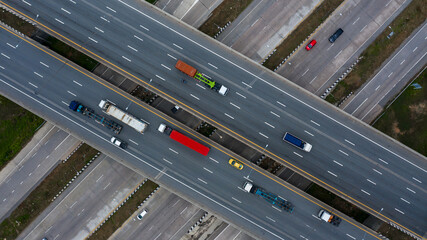 Aerial top view road traffic interchange in city, Aerial view of highway and overpass in city,...
