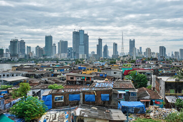 View of Mumbai skyline with skyscrapers over slums in Bandra suburb. Mumbai, Maharashtra, India - 507647005