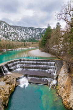 deep turquoise blue river at the Lechfall in F&uuml;ssen, Austria