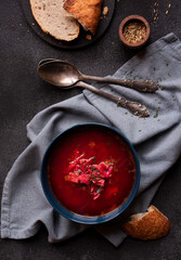 Red beetroot vegetable soup with bread, hot soup in a bowl