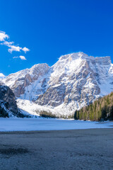 frozen Lago di Braies and its mountain scenery (Dolomites, Italy)