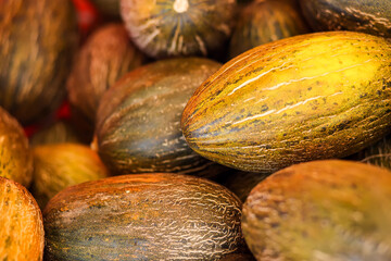 Melon background on a shelf in market. Organic eating. Farmer's food.