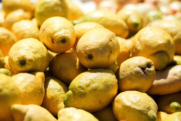 Lemon background on a shelf in market. Organic eating. Farmer's food.