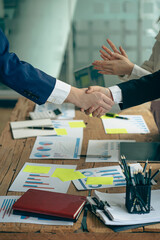 businesspeople shaking hands after the meeting Confident business team shakes hands during office...