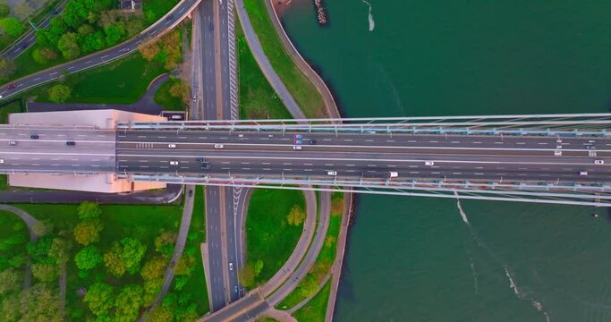 Diverse Speed Roads Going In Different Directions. Cars Going Quickly Along Green Areas And Huge Bridge.