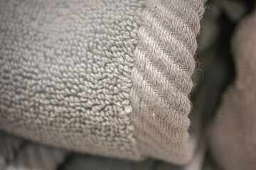 Clean towels arranged in home laundry room - Macro concept