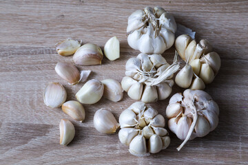 Garlic Cloves and Bulb on wooden background