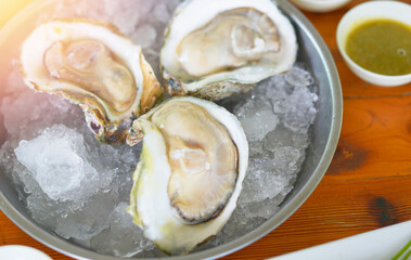 oysters in plate serve with seafood dipping