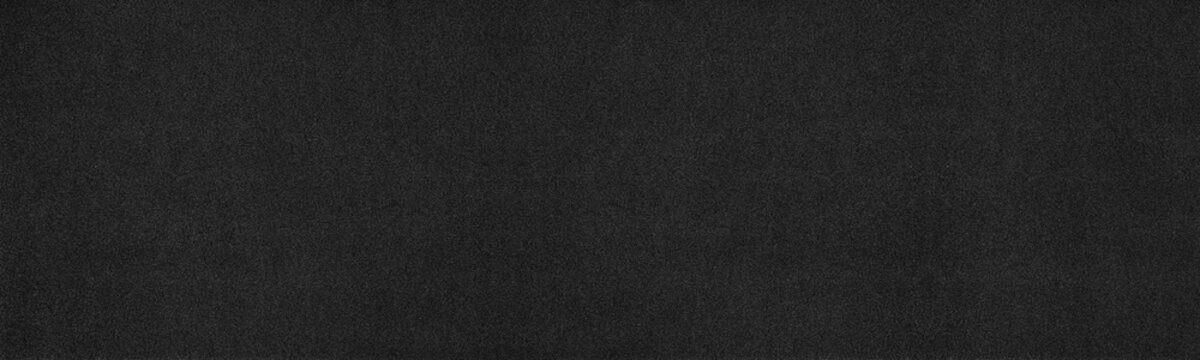 Black paper texture. Dark fine textured surface wide abstract background