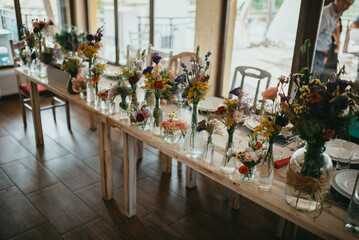 Rustic table decoration. Decoration with flowers.