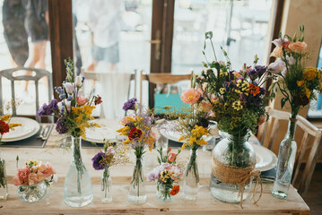 Rustic table decoration. Decoration with flowers.