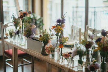 Rustic table decoration. Decoration with flowers.