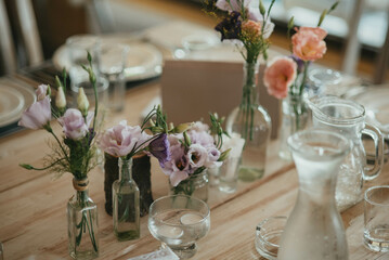 Rustic table decoration. Decoration with flowers.