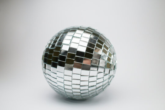 glass disco ball. Silver disco mirror ball isolated on white background. Disco ball closeup isolated on white background. Shiny disco ball white.