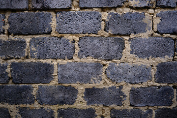 The brick wall of the building is gray for the background
