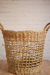 Obraz premium Clothes in basket on floor against a wall 