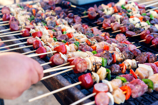 meat and vegetables brochettes or anticucho on the grill closeup