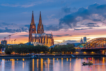 View of the Hohenzollern Bridge over the Rhine River and the iconic Cathedral of Cologne - UNESCO...