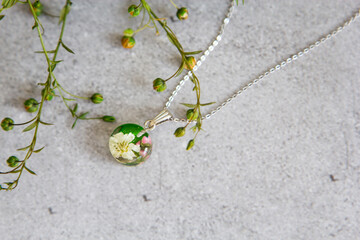 Real flowers in epoxy resin, jewelry