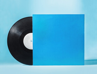 Vinyl music disc with blank blue cover isolated on blue background