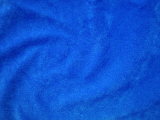 Blue velvet fabric texture used as background. Empty blue fabric background of soft and smooth textile material. There is space for text..