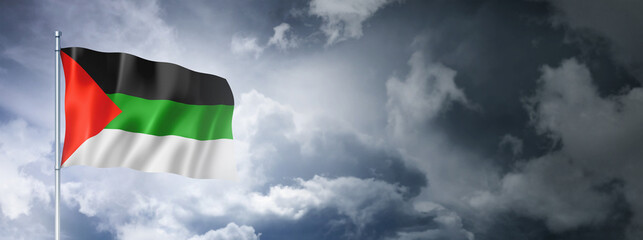 Arabic langage flag on a cloudy sky