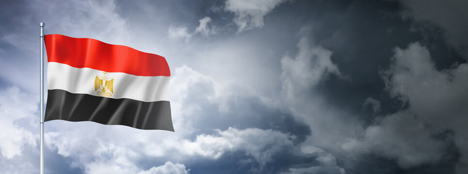 Egyptian flag on a cloudy sky