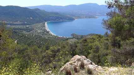 Psatha beach as seen from distance with clear calm sea, West Attica, Greece