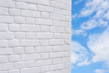 White brick wall texture on a blue sky background