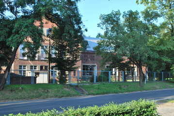 brick building behind trees