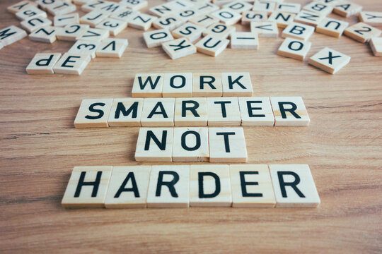 Work smarter not harder text. Motivational reminder from wooden blocks