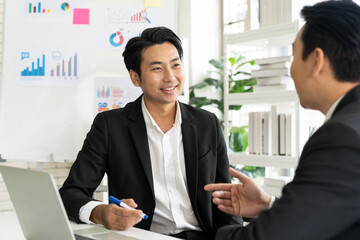 Group of Asian businessman wear suit discussion business plan in the office. Asian businessman...