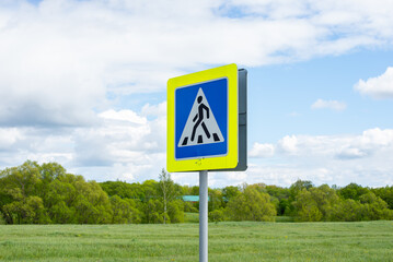 Road sign. Pedestrian crossing sign on blue sky background