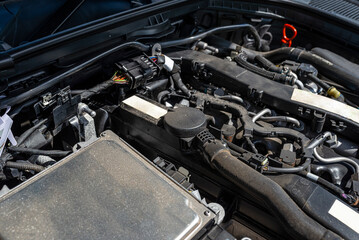 Fototapeta premium A modern diesel engine with 170 horsepower and an engine capacity of 2.2 liters. Visible engine equipment, spark plugs and electric wires.