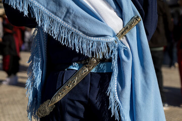 Rear view in detail of the traditional belt and knife (facon) of an Argentine gaucho. Close-up,...