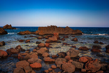 View of the lava beach of Linosa Called Faraglioni