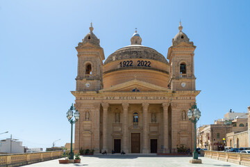 Fototapeta na wymiar The Parish Church of the Assumption of the Blessed Virgin Mary into Heaven, built in the 20th century it is the Mgarr Parish Church in Malta.