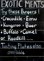 SIGNS- Australia- Close Up of a Funny Hand Painted Sign Selling Exotic Burgers