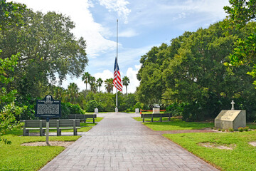 Flag at half mast at the Veterans Memorial Island Sanctuary in Vero Beach, Florida.