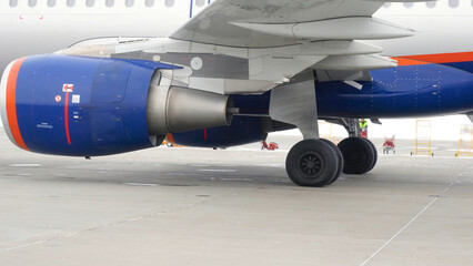 Plane rides on runway. Stock footage. Plane is preparing for takeoff moving along runway in winter. Plane on runway before flying abroad for vacation