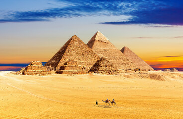 Beautiful sunset by the Pyramids of Giza in the sands of Egypt desert