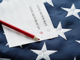 A mark on the ballot against the Republican, a red pencil on the background of the US flag....