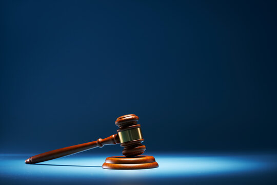 gavel hammer against blue background