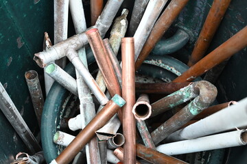 recycling, scrap copper pips and old hot water tank 