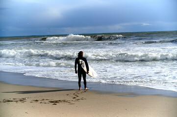 Windsurfer waiting for a good wave by the sea