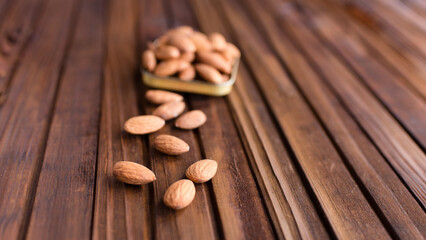 almond seeds  on a wooden background