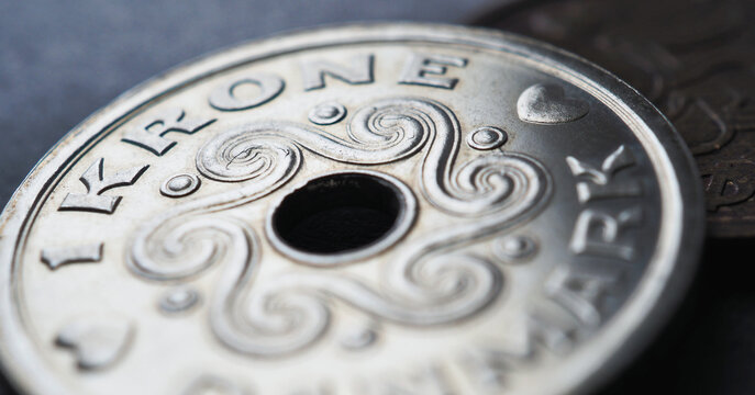 1 Danish krone coin close up. National currency of Denmark. Money illustration for news about economy or finance. Banking and credit. Wages and taxes. Horizontal stories. Macro
