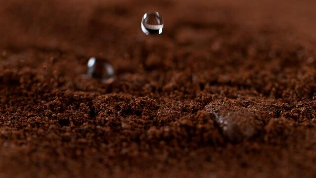 Super slow motion of pouring hot water on ground coffee, 1000 fps, filmed on high speed cinematic camera