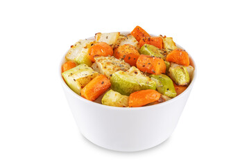 Roasted potato, carrot and zucchini bowl on a white isolated background